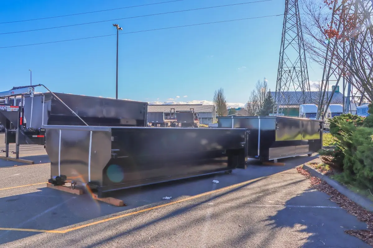 Roll-off dumpster ready for waste disposal at job site for Concrete Dumpster Rental in Emerson